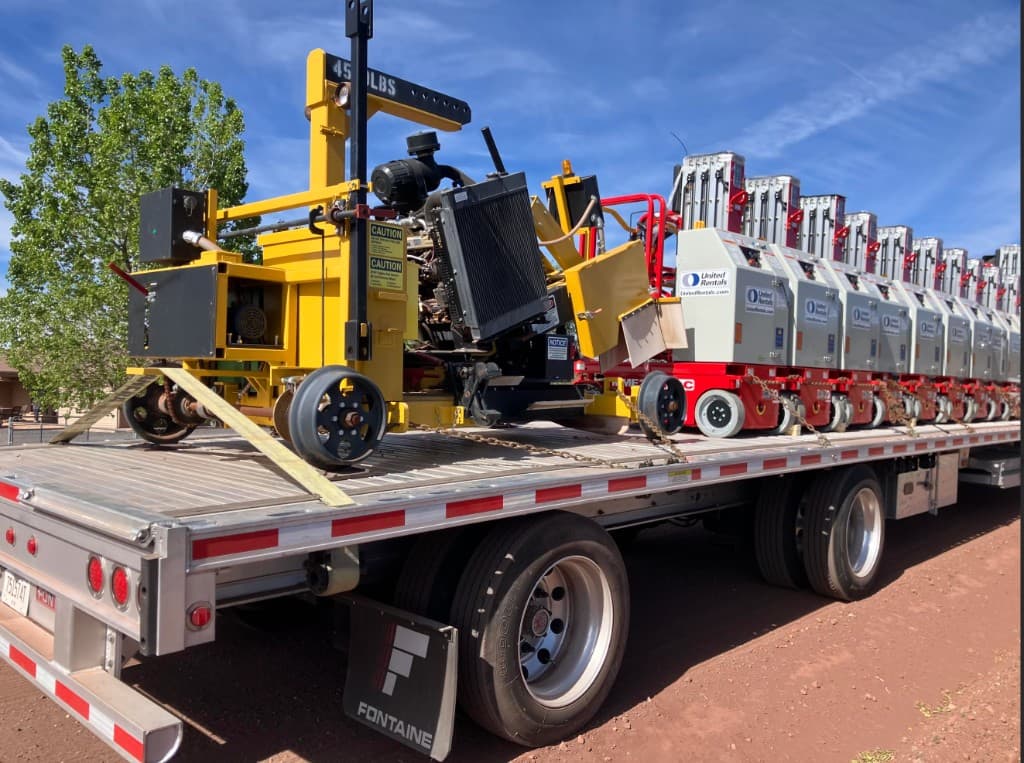 Fontaine flatbed trailer loaded with specialized rental equipment
